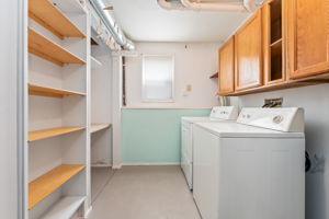 Laundry Room has a laundry chute, plenty of cabinet space, mechanical, and pocket door.