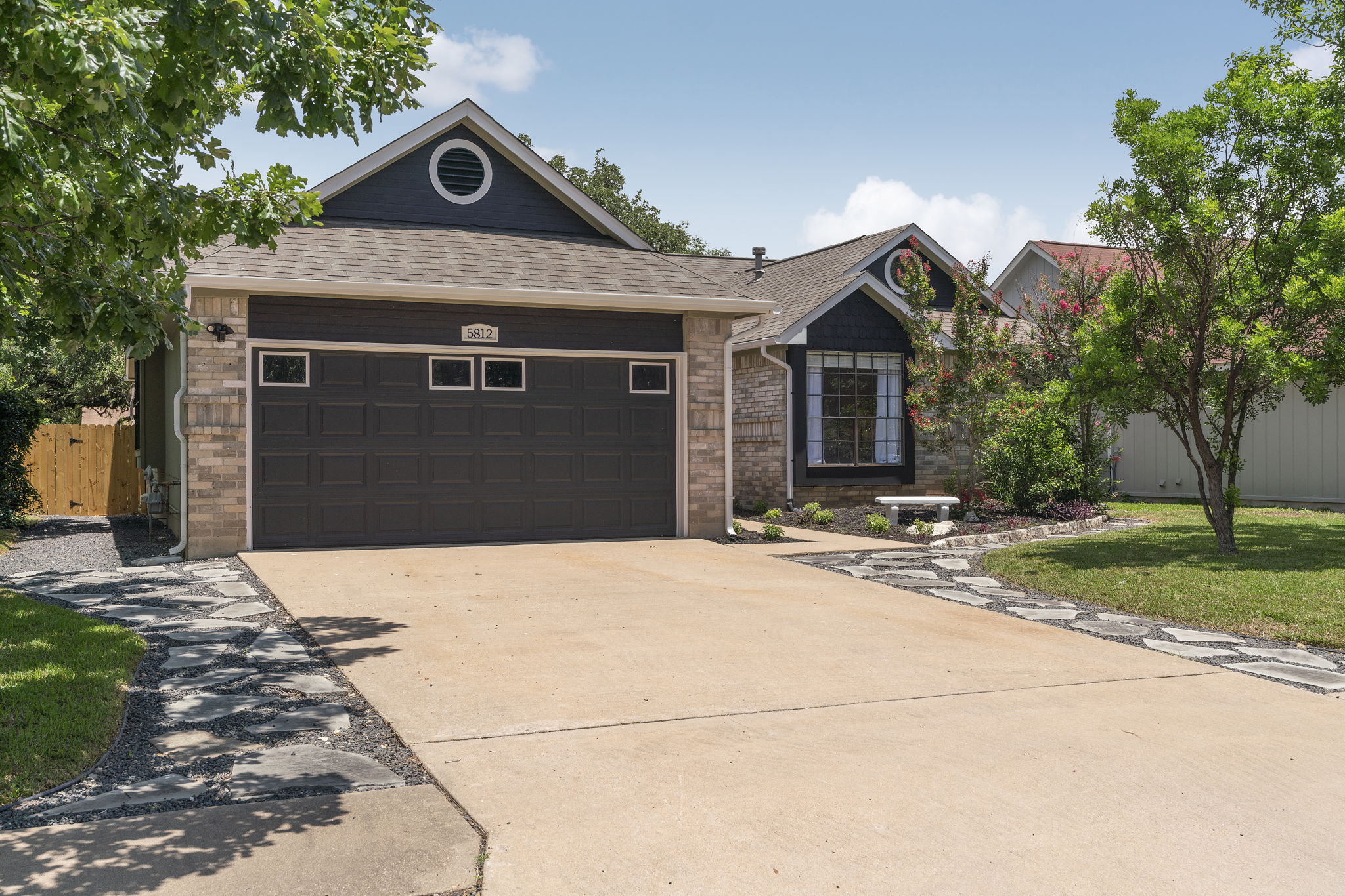 Left side view of low maintenance landscaping