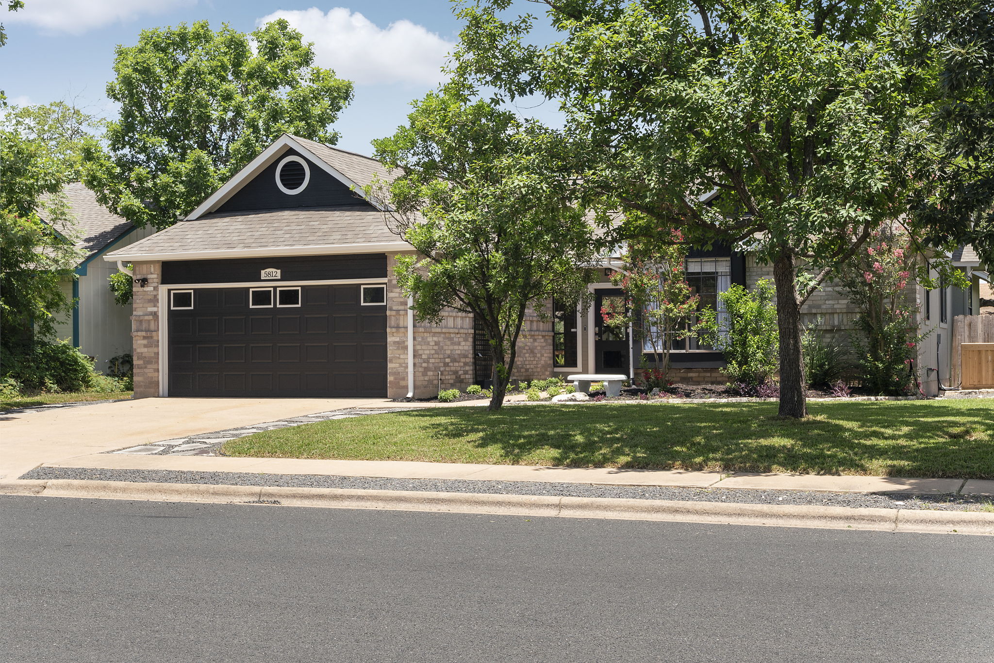 Right side view of the lush landscape and beautiful home.