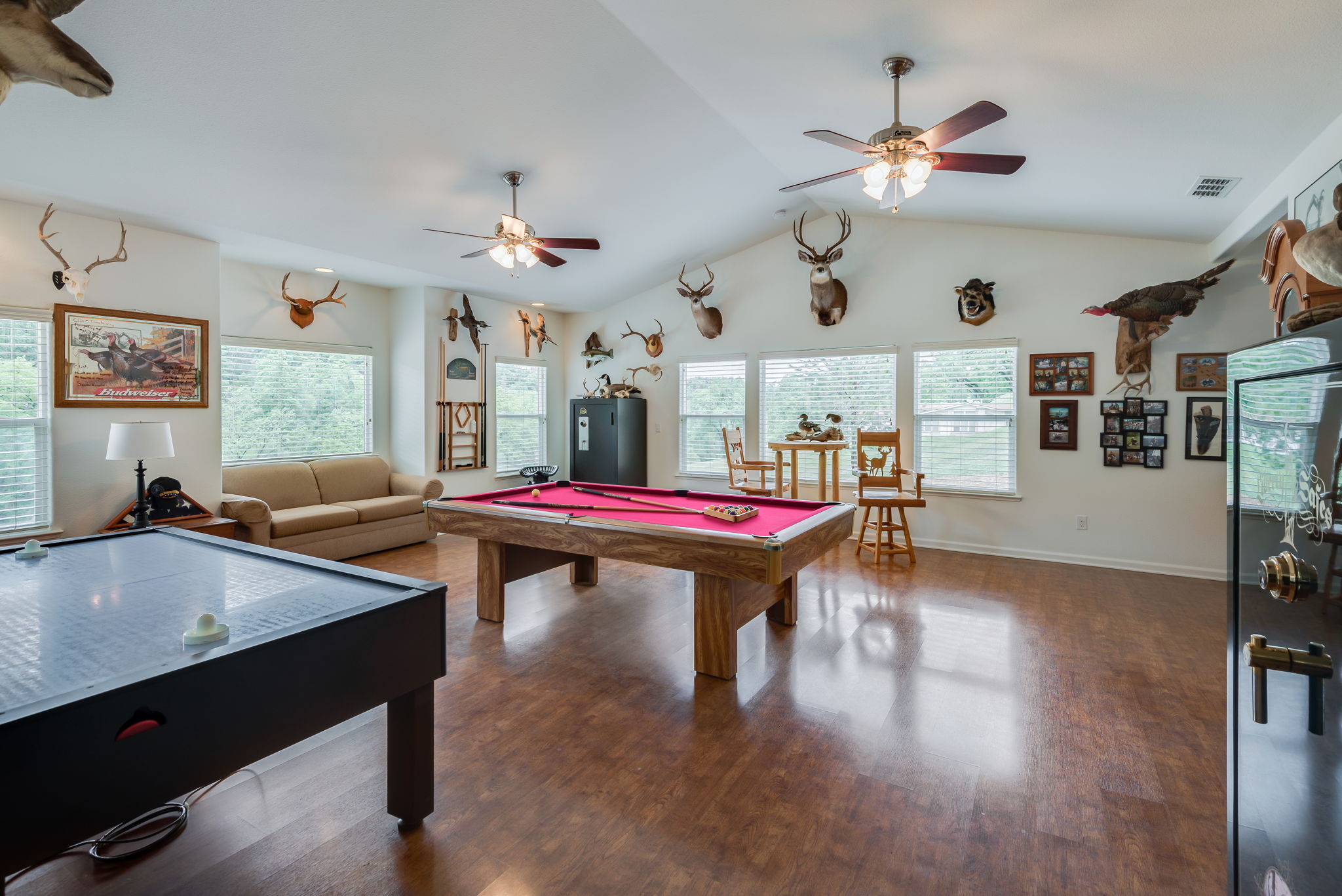 500 sq ft game room, Wet Bar with Hickory Cabinet and Granite Countertop, Large picture windows, Engineered Hardwood Flooring