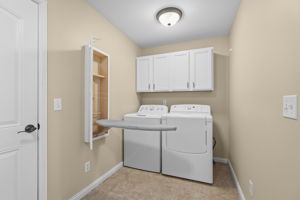 LAUNDRY W/ WASHER/DRYER INCLUDED AS WELL AS IRONING BOARD