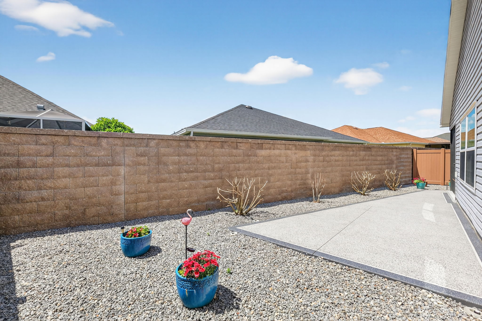 Rear Patio with Low-Maintenance Stoned Landscaping