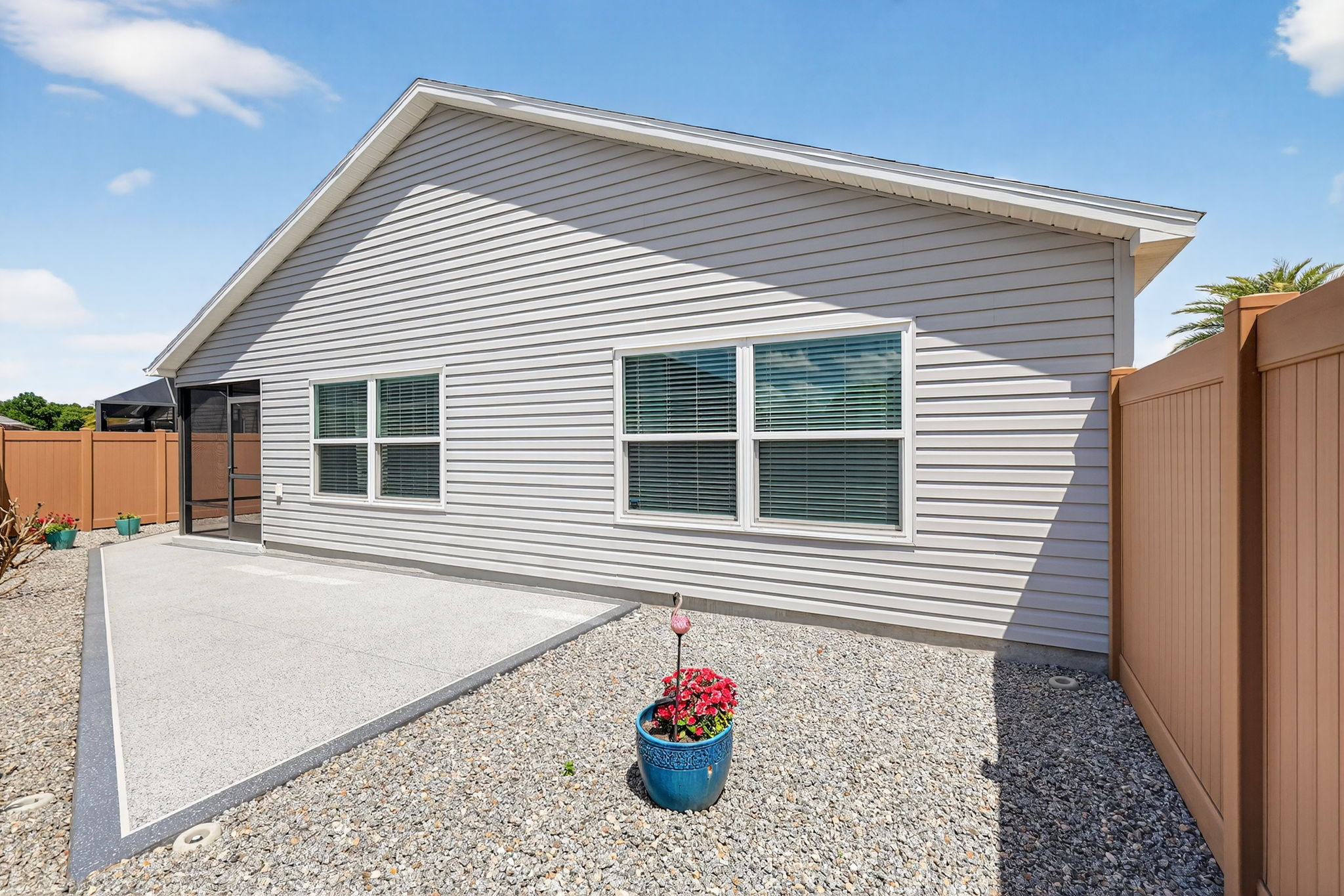 Rear Patio with Low-Maintenance Stoned Landscaping