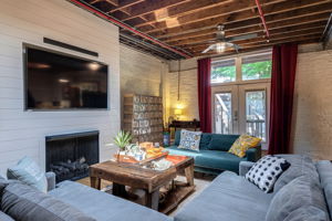 Glass French doors lead out to private patio