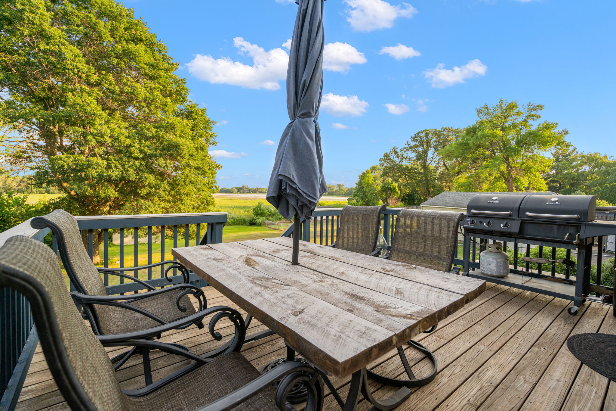 Take in the views over Egg Lake from the wooden backyard deck at 5857 Oneka Lake Boulevard N.