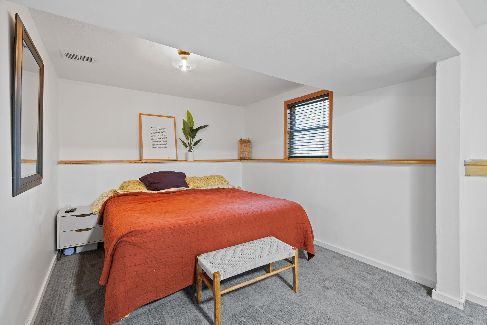 The expansive lower-level primary bedroom at 5857 Oneka Lake Boulevard N features a walk-in closet.