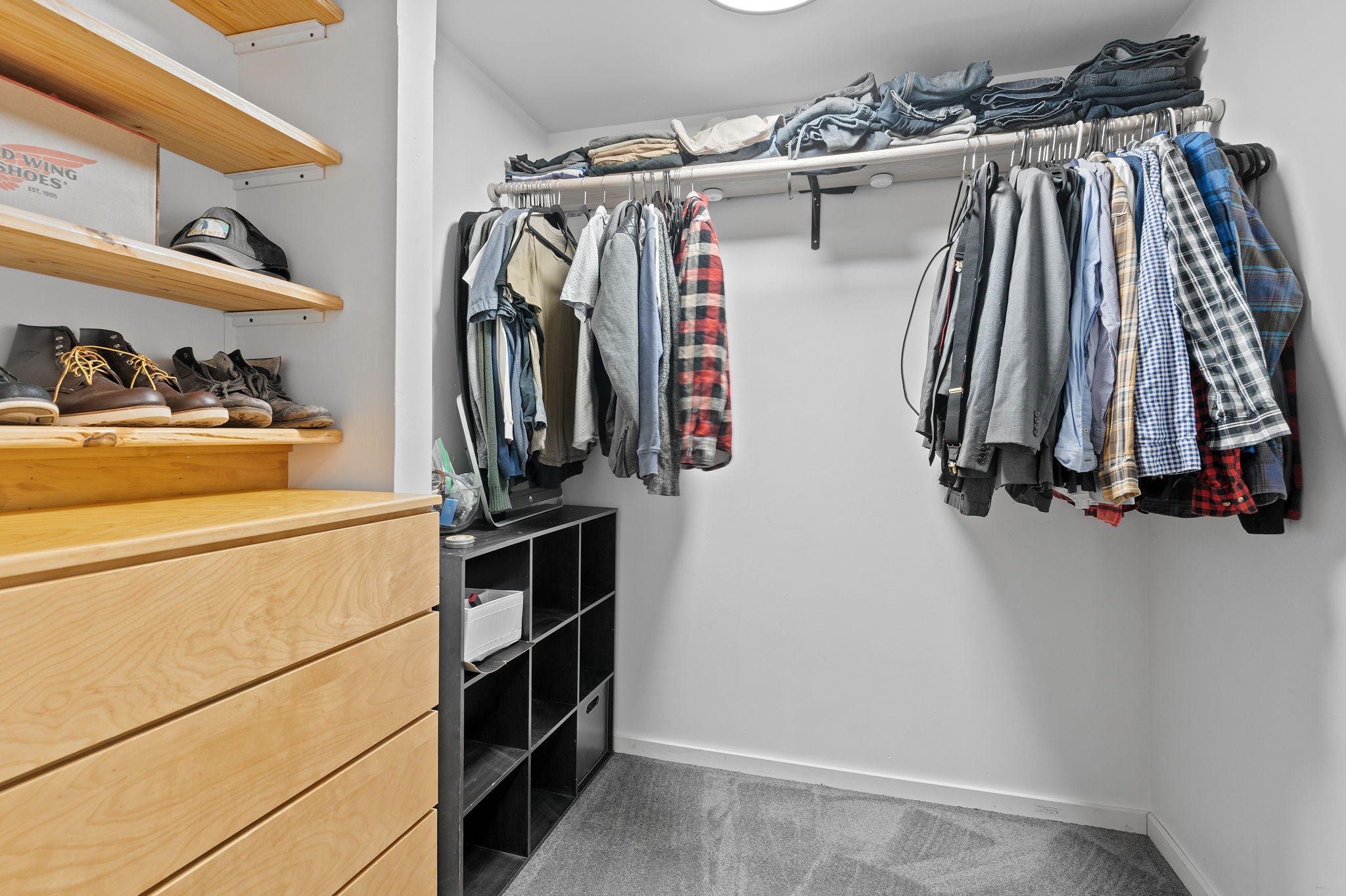 The expansive lower-level primary bedroom at 5857 Oneka Lake Boulevard N features a walk-in closet.