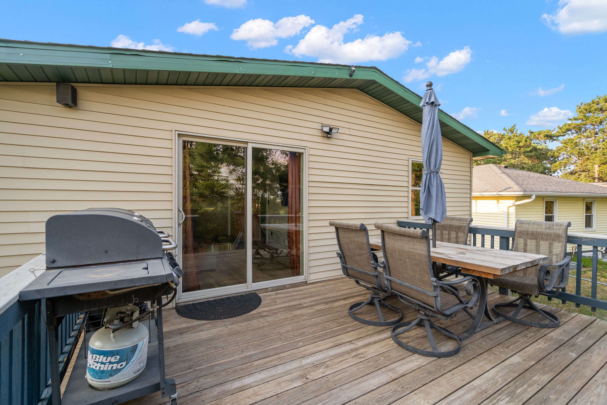 Take in the views over Egg Lake from the wooden backyard deck at 5857 Oneka Lake Boulevard N.