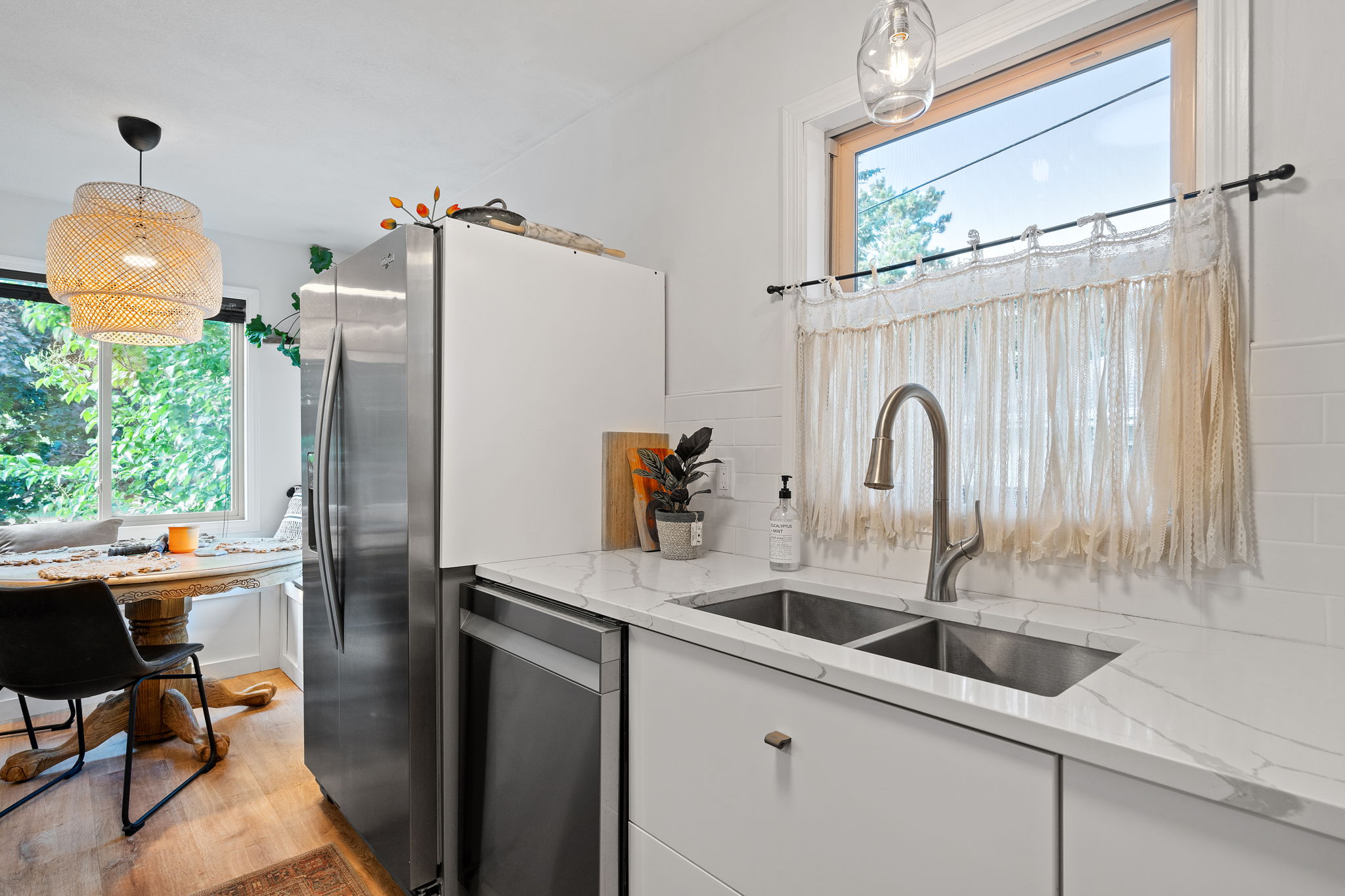 The centerpiece of the renovated upper level at 5857 Oneka Lake Boulevard N is the beautifully updated kitchen, featuring quartz countertops and stainless steel appliances.