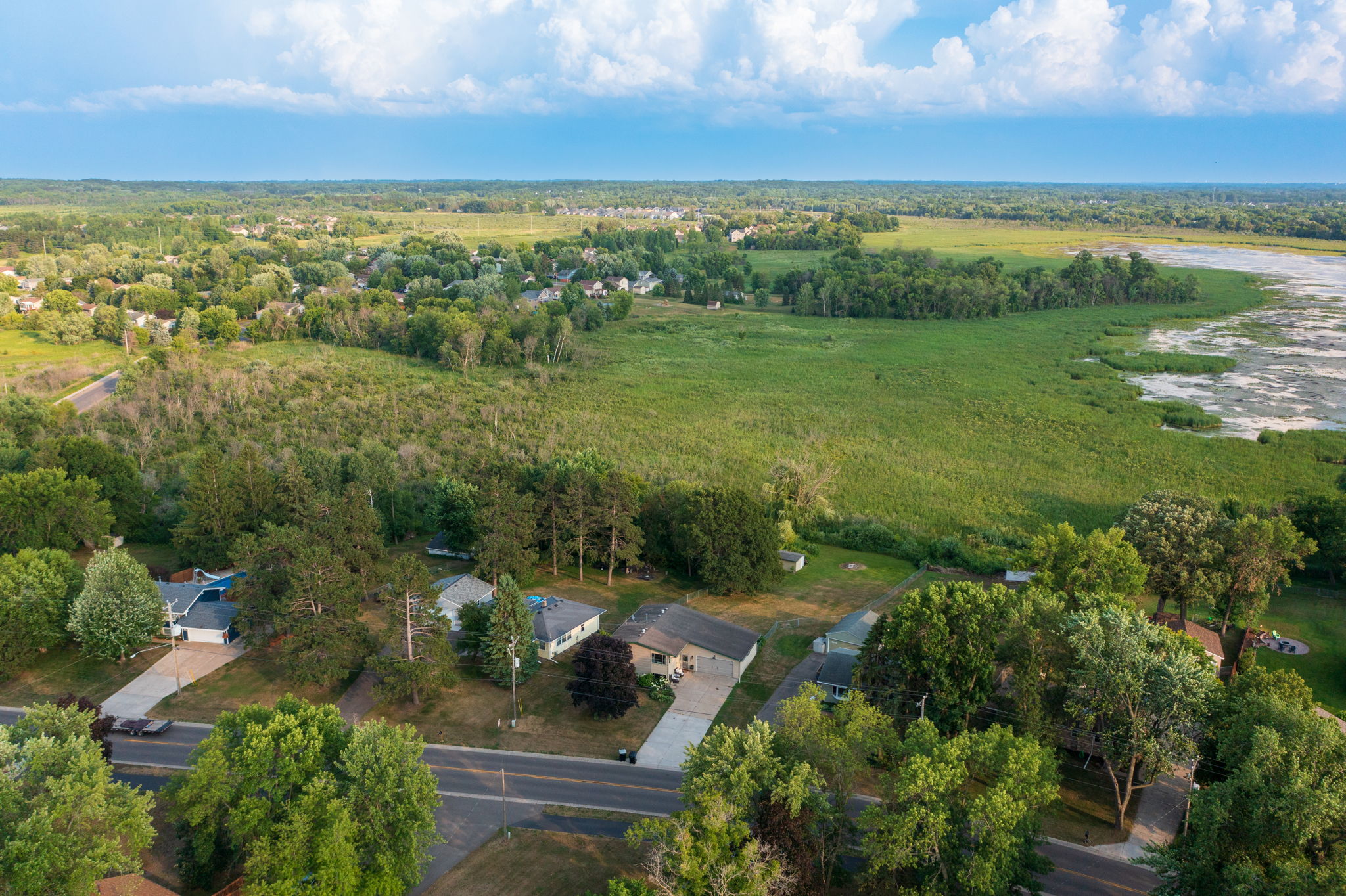 At 5857 Oneka Lake Boulevard N, not only do you get a massive fenced-in green space—you also enjoy a direct connection with nature in your own backyard.