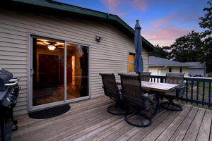 Take in the sunset over Egg Lake from the wooden backyard deck at 5857 Oneka Lake Boulevard N.