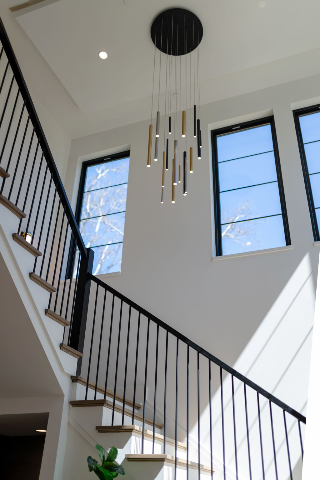 Light-filled Two Story Foyer with Oak Staircase