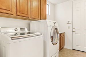 Laundry Room w/ Utility Sink & Storage