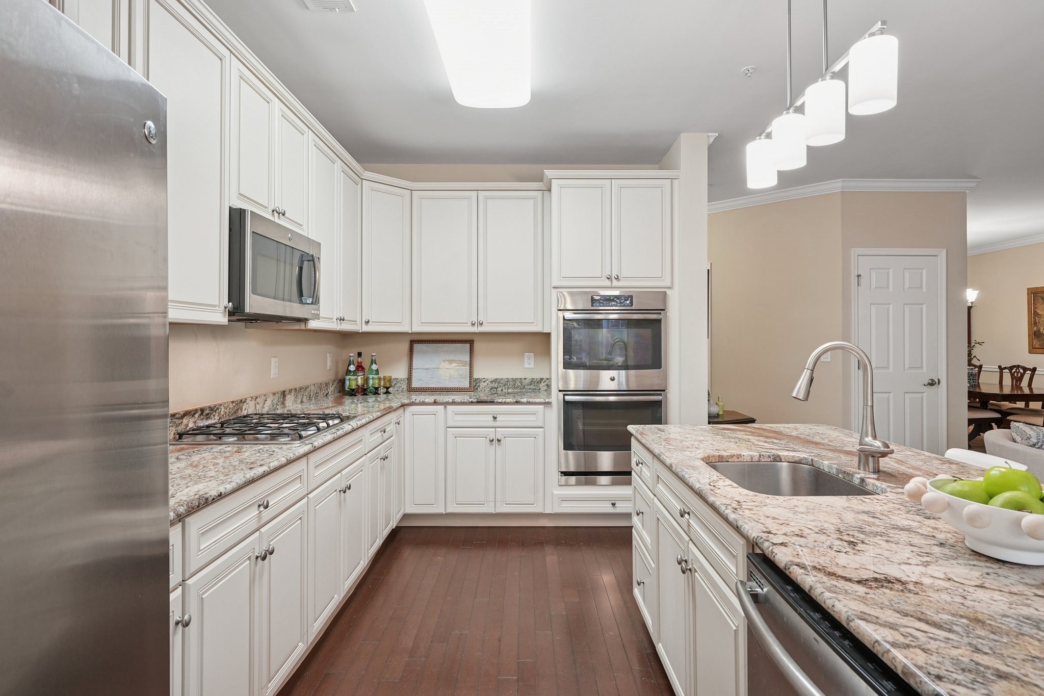 Lovely quartz countertops. Upgraded appliance and finishes from the start.