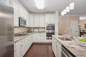 Lovely quartz countertops. Upgraded appliance and finishes from the start.