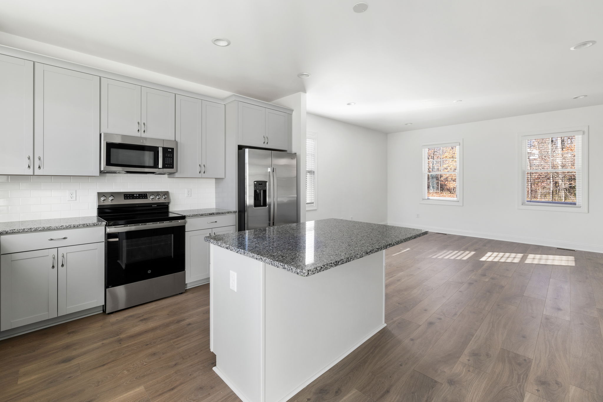 Kitchen opens to living area perfect for entertaining.