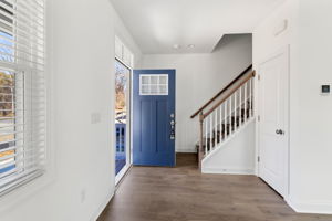 Insulated front door to covered full front porch.
