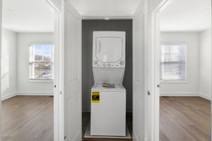 Stack washer and dryer closet in 2nd floor hallway.