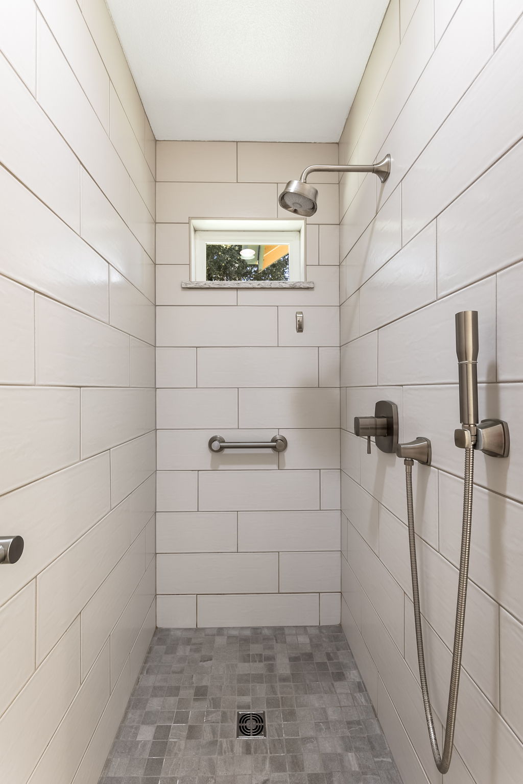 Walk-in tiled shower.