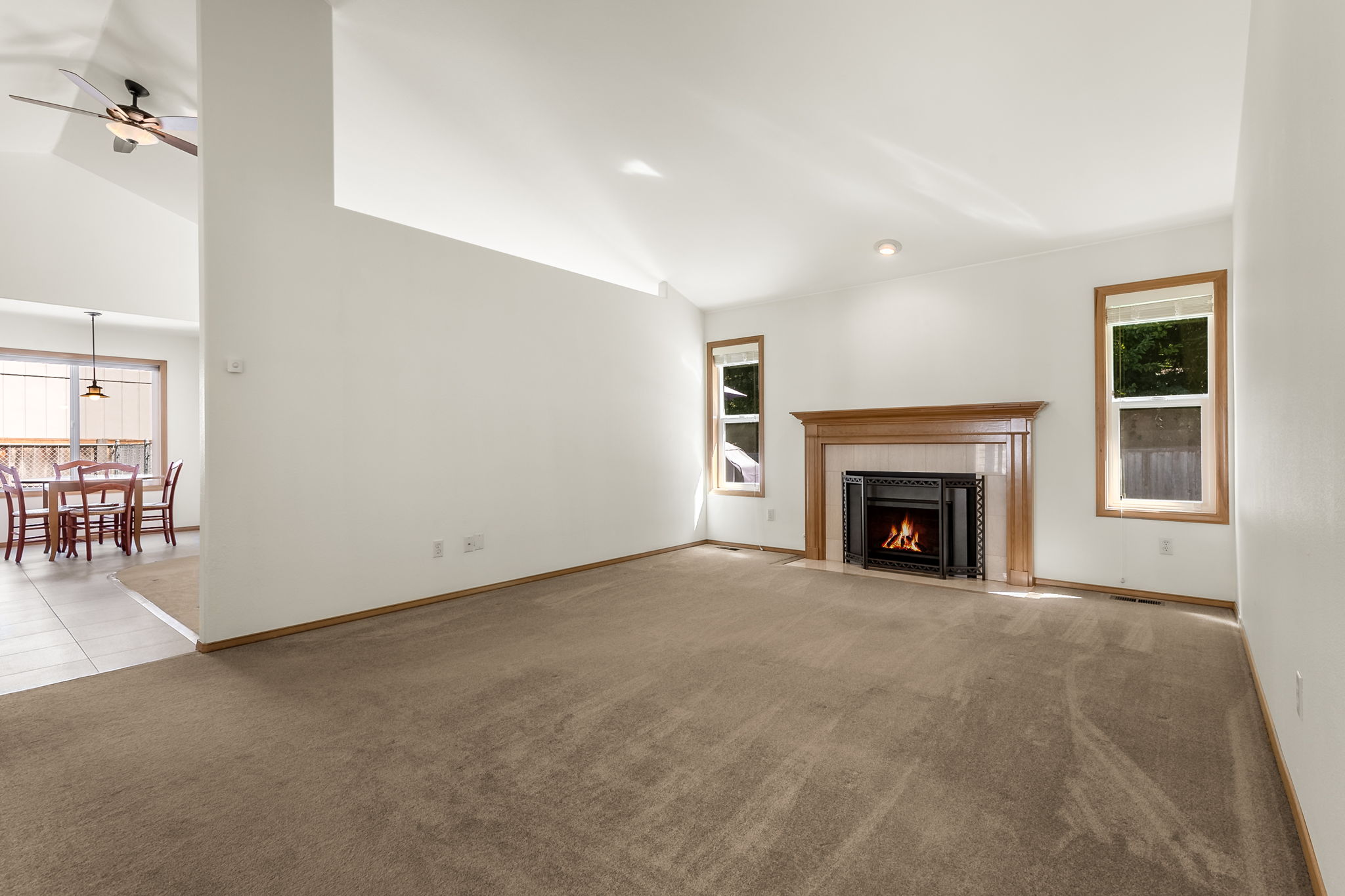 Enter into the living room that features a cozy gas fireplace.