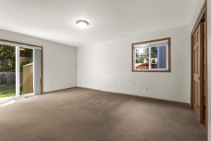 Large walk in closet is hidden behind those closet doors.