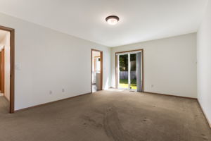 Primary suite with it's own slider door to the back yard.