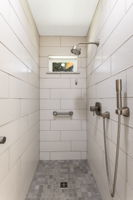 Walk-in tiled shower.
