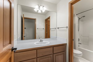 Guest bath with a full tub/shower combo.
