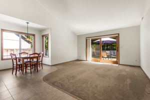 Eating nook and family room with XL slider door to your beautiful trex deck.