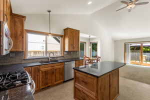 Tons of storage in the kitchen, which is open to the eating space and family room. Sink has a separate filtered water faucet!