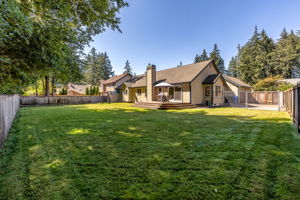 From the back corner, you can see the separately fenced in paved side yard.
