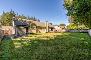 Great, level back yard has so much room to run.