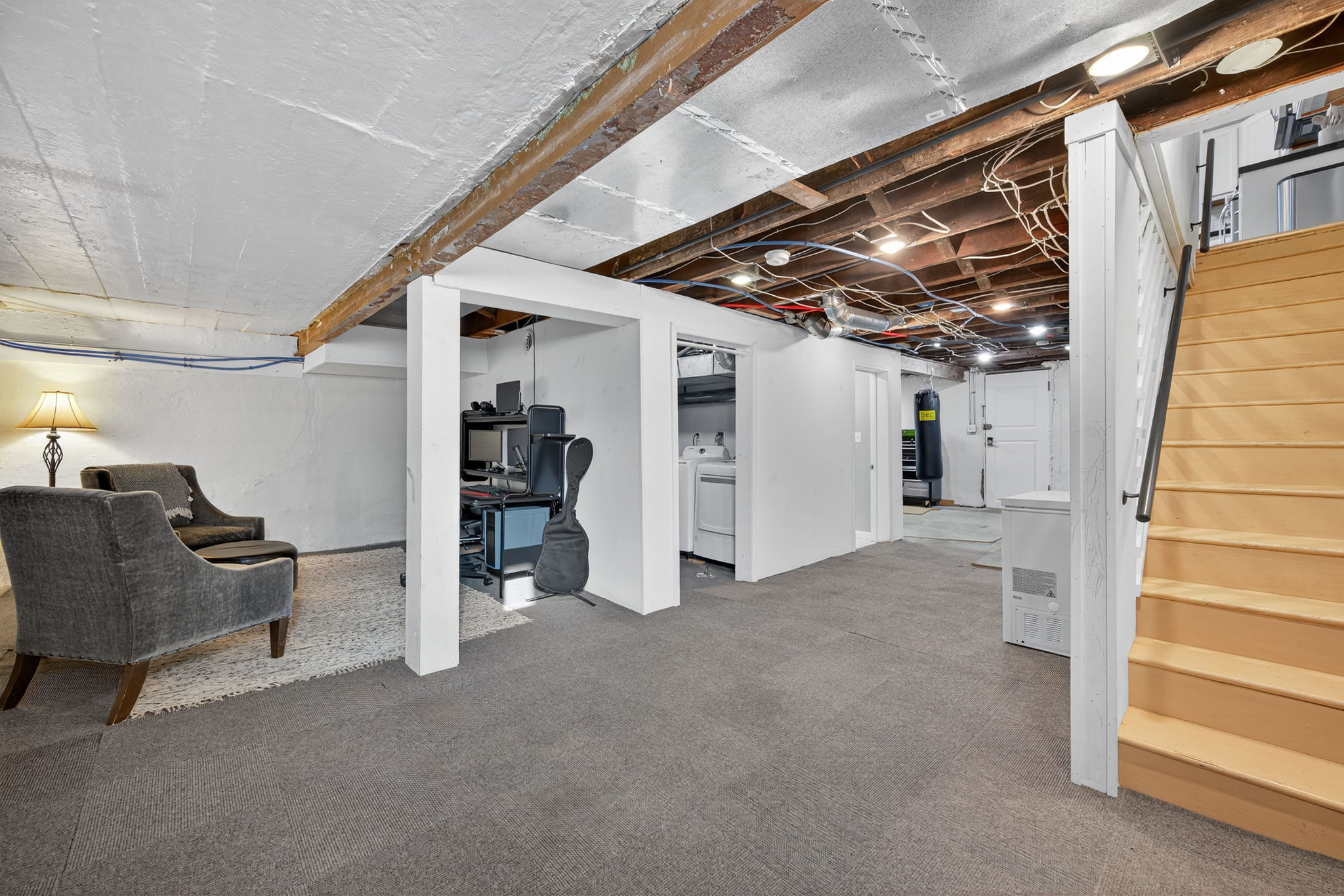 Heading down to the walk-out lower level recreation room, you would never know that you are in a 100 year old home.  So much useable square footage!