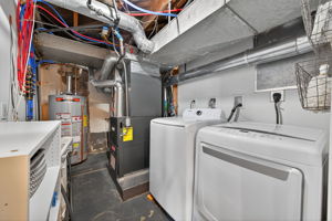 The utility room is clean and tidy with a BRAND NEW HVAC system and newer water heater.  Washer and dryer are included in the sale.