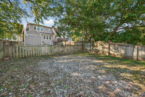 You also have alley access and an ENORMOUS private oversized parking area for 2 (and 1/2) cars!  Build a garage or use it as is.