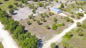 High-altitude aerial view revealing the property's deep lot lines and its integration into the surrounding Punta Gorda landscape.