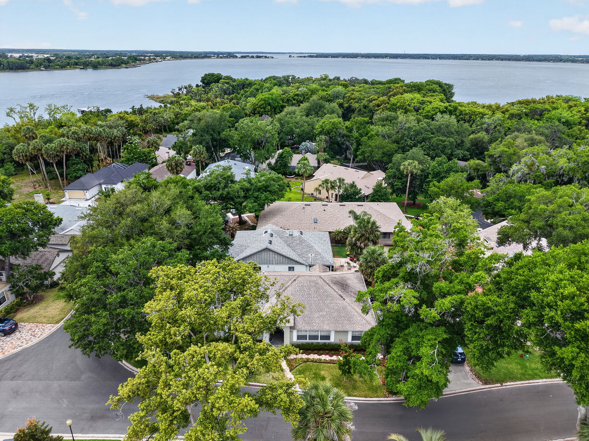 605 Sandlake Court with Lake Dora and the Community Dock just beyond the trees