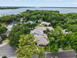 605 Sandlake Court with Lake Dora and the Community Dock just beyond the trees