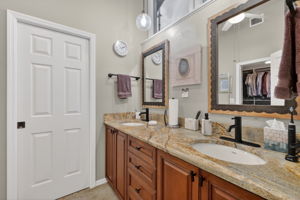Double Vanity in the Primary Bathroom - the WC is behind the pocket closed pocket door