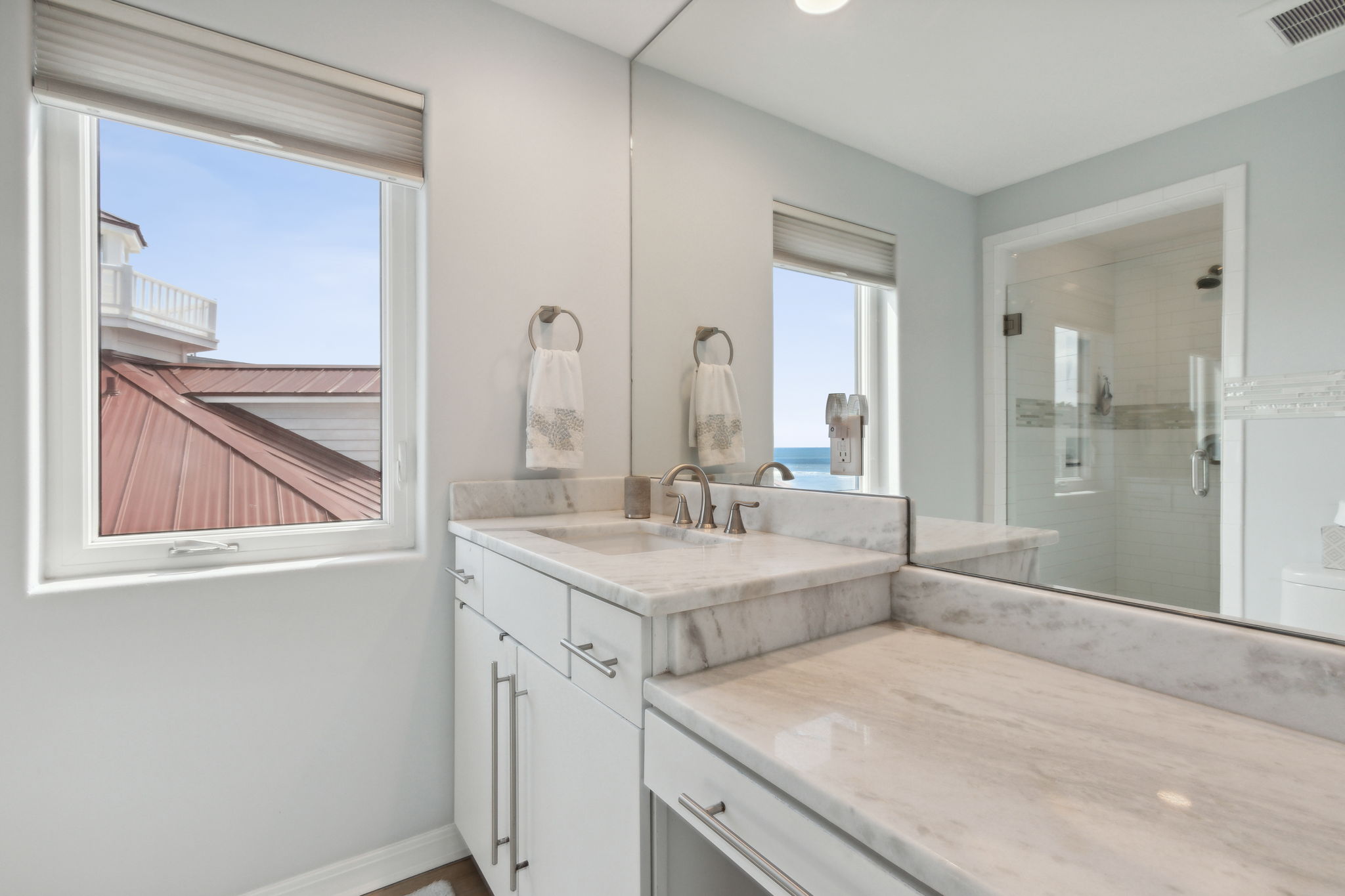 The en-suite bathroom includes a dressing table...