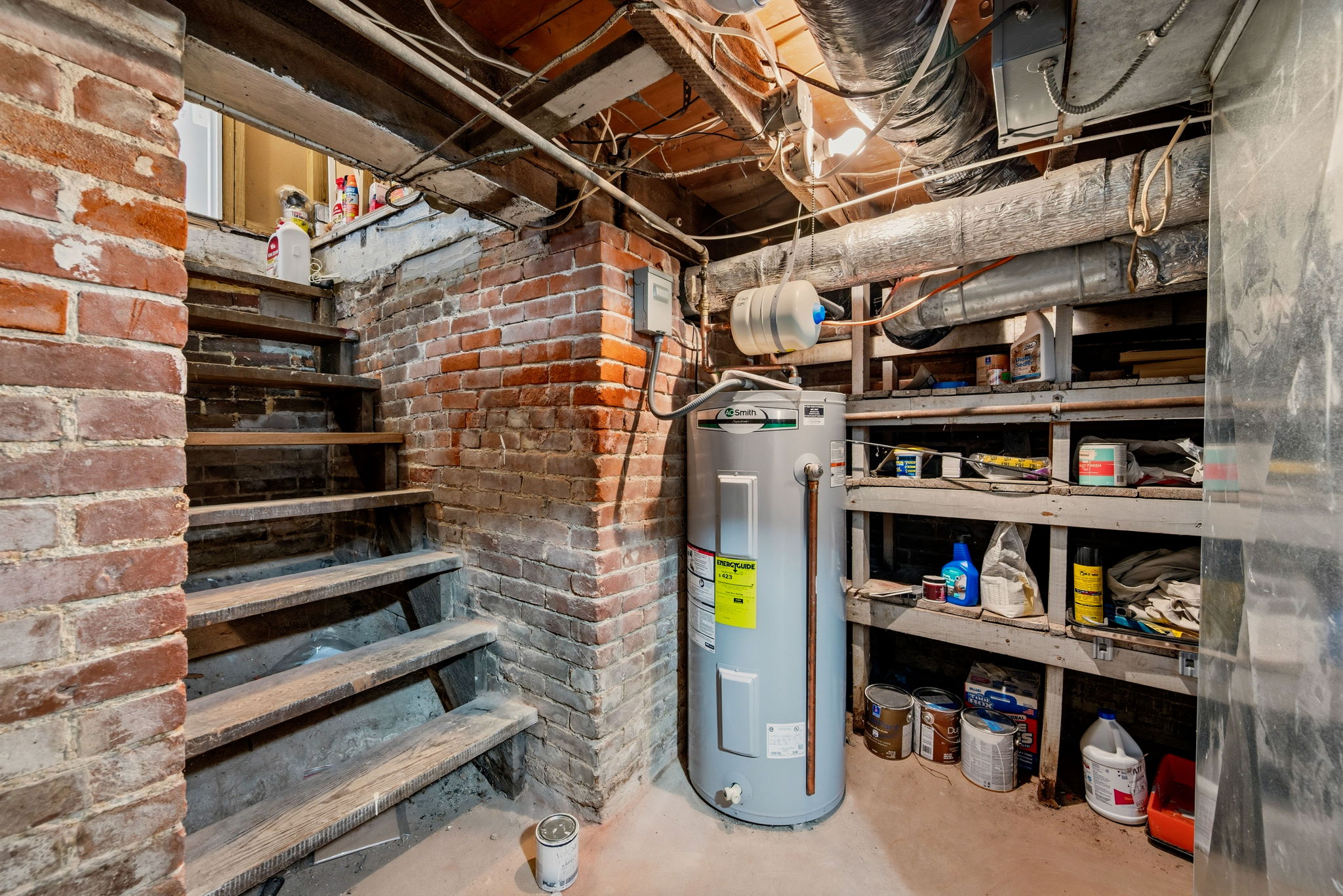 Heading to the lower level, you see the age of the home in the original cellar