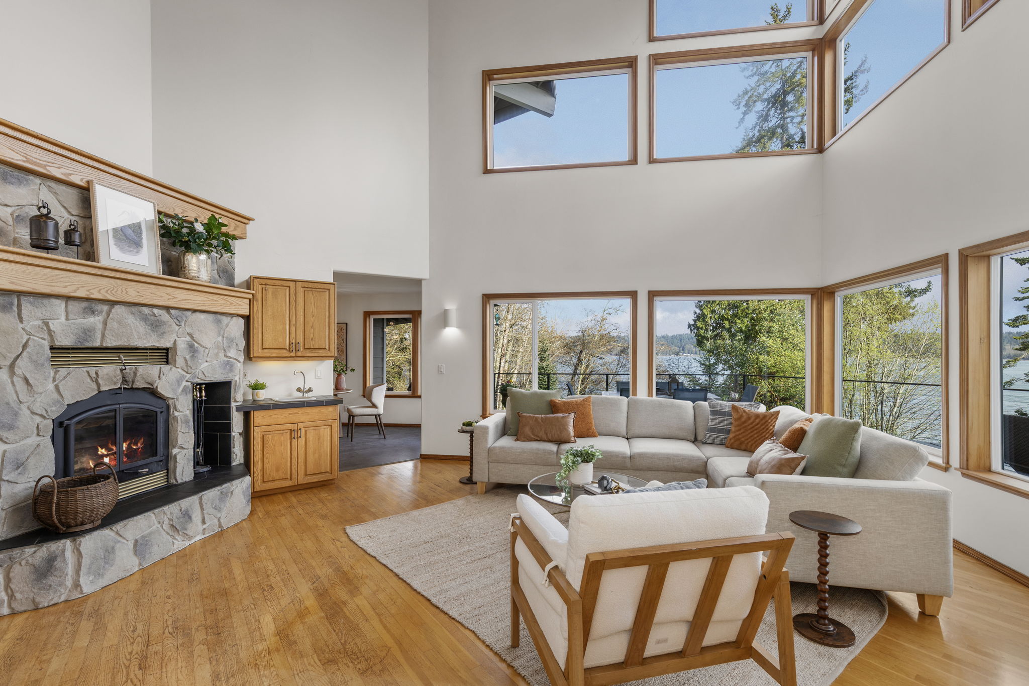 Family room with soaring ceilings, wet bar and fireplace.