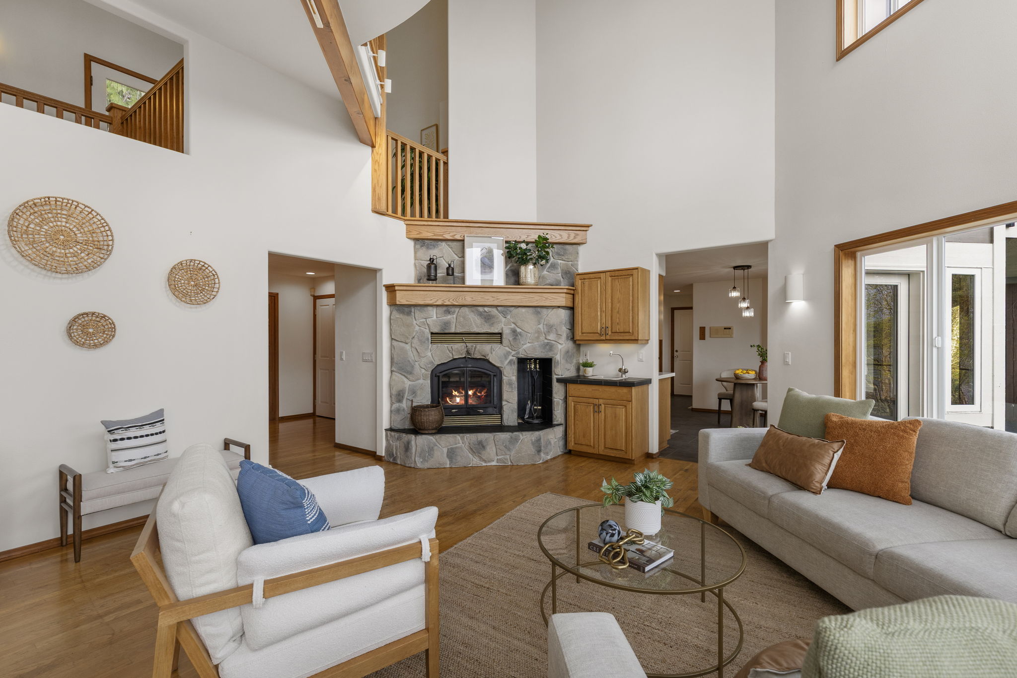 Family room with dedicated office out of shot to left and kitchen/eating nook ahead to right.