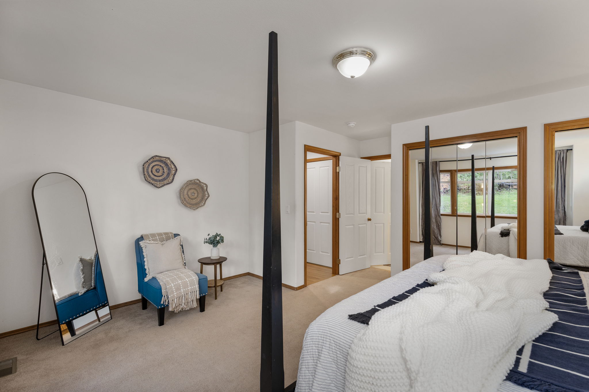 Another view of main floor primary looking onto attached bath.