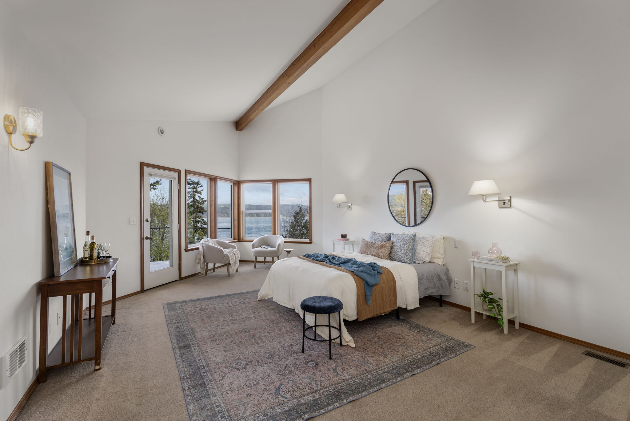 HUGE upper level primary suite with views, access to private balcony and several large closets.