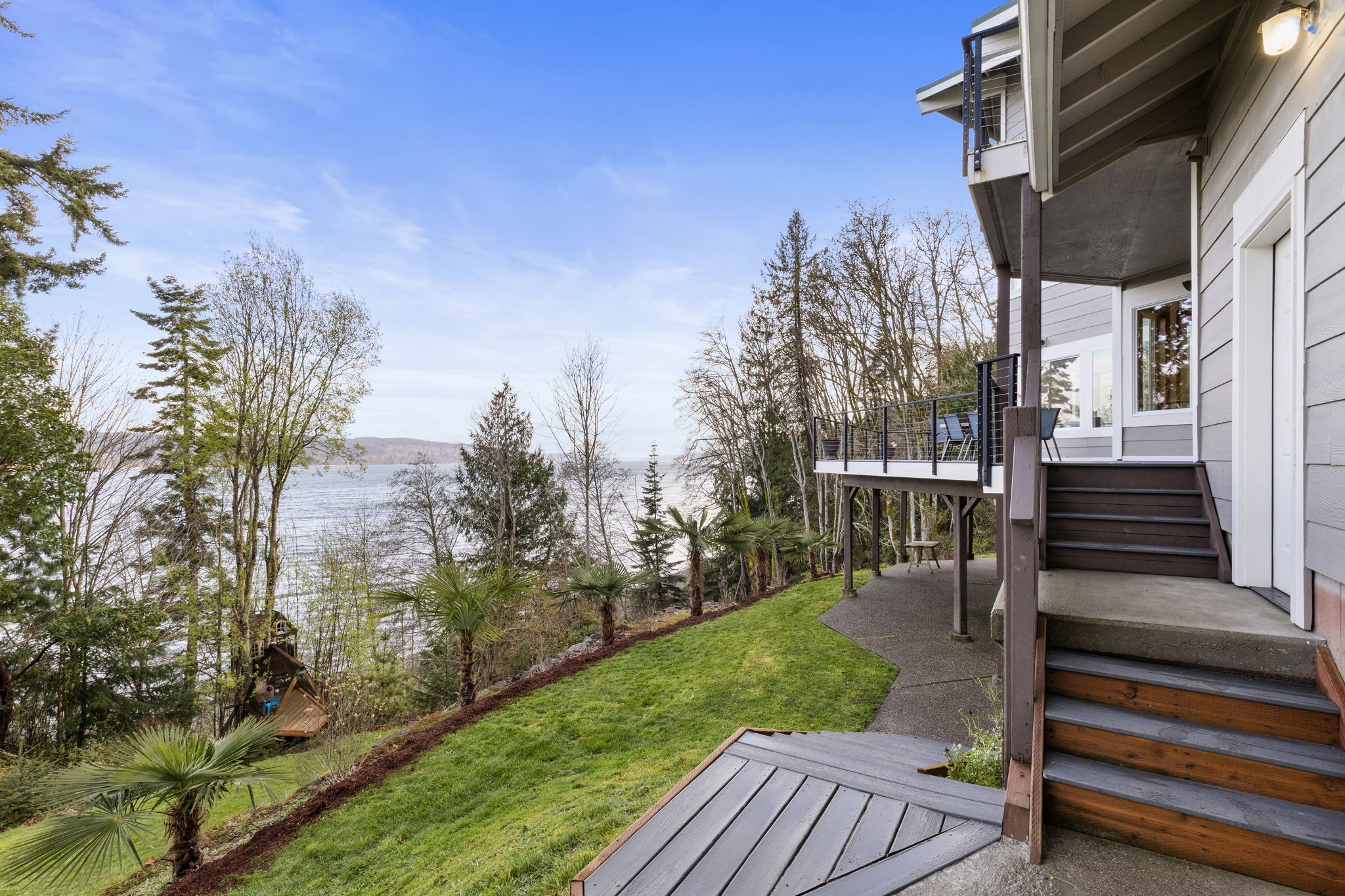 So many places to enjoy life on this beautiful property. Stairs down to the beach!