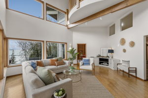 Dedicated office through doorway straight on and curved viewing mezzanine above.