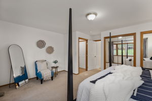 Another view of main floor primary looking onto attached bath.