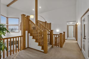 Upper level with grand entrance to curved viewing mezzanine! French doors to the right lead to a private balcony!