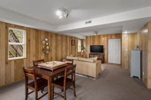 More of the lower level...HUGE storage room behind that door! This area plumbed for kitchenette!